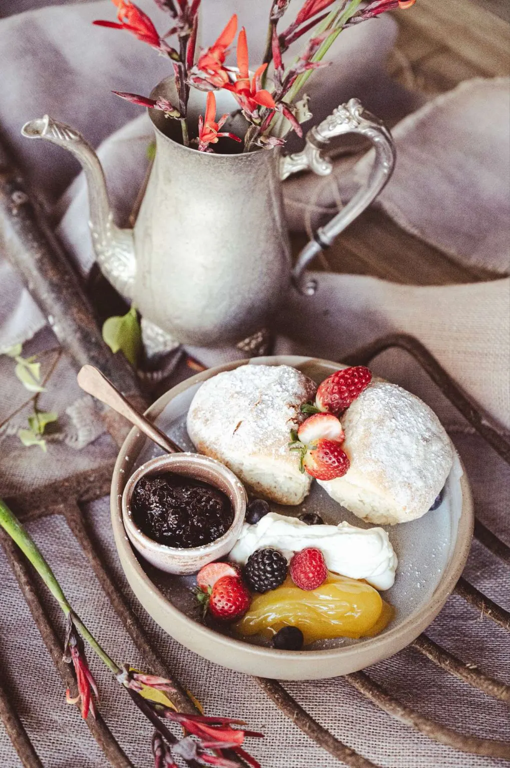 Freshly baked scones with jam, cream and berries at the Rivermill Café